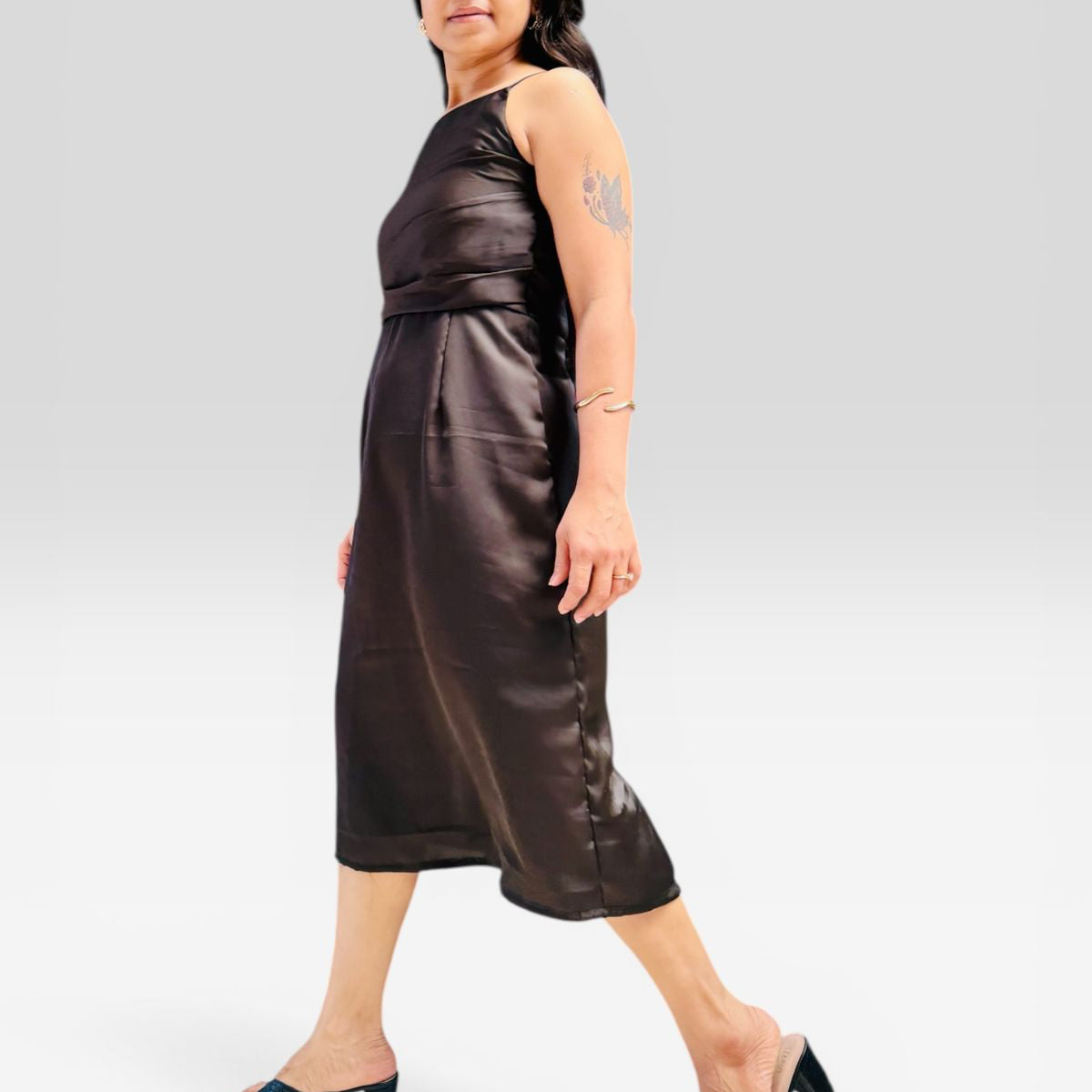 Woman wearing a brown satin dress on a white background